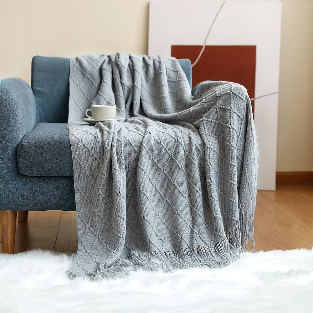  Made of high-quality imitation cashmere, this plush blanket offers a soft and cozy feel that you'll love to snuggle up with.