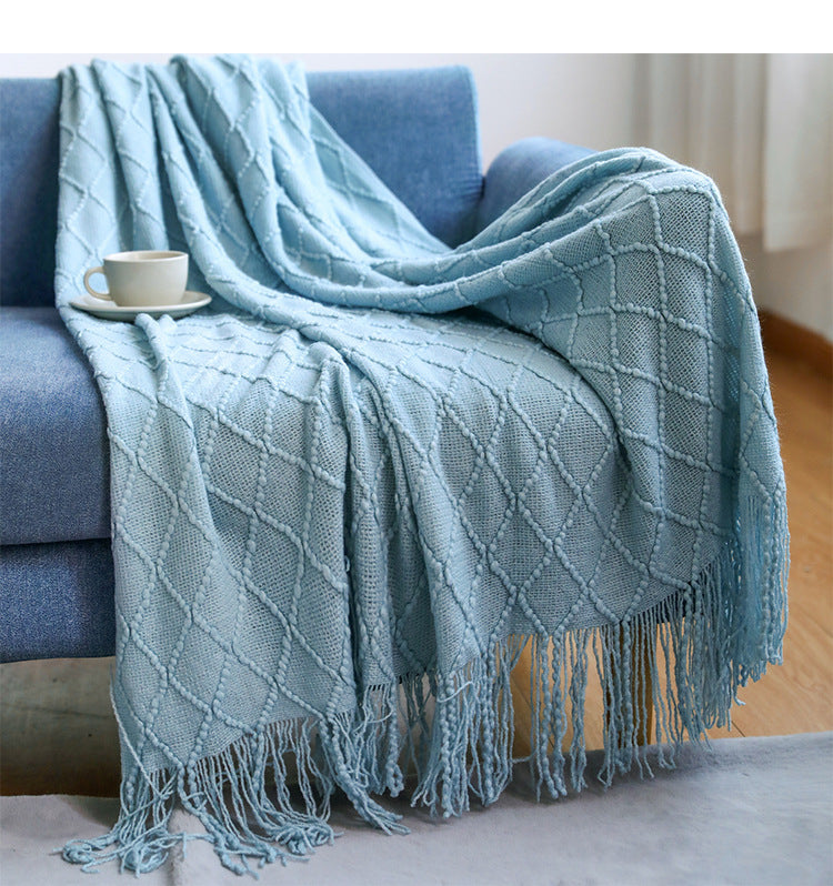  Made of high-quality imitation cashmere, this plush blanket offers a soft and cozy feel that you'll love to snuggle up with.