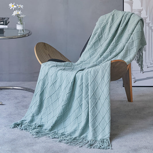  Made of high-quality imitation cashmere, this plush blanket offers a soft and cozy feel that you'll love to snuggle up with.